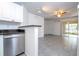 Bright living room with tiled floors, ceiling fan, and sliding doors to let in natural light at 5136 Park Central Dr # 212, Orlando, FL 32829