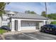 Mail center with parking and a modern gray roof in a well-maintained community at 5136 Park Central Dr # 212, Orlando, FL 32829