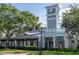 Exterior view of Charles Towne restaurant with outdoor seating and a clock tower at 5136 Park Central Dr # 212, Orlando, FL 32829