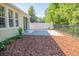 Inviting backyard featuring a brick patio, wood mulch landscaping, and a privacy fence at 9516 Piccadilly Sky Way, Orlando, FL 32827
