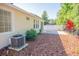 Inviting backyard featuring a brick patio, wood mulch landscaping, and a privacy fence at 9516 Piccadilly Sky Way, Orlando, FL 32827