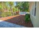 Inviting backyard with wood mulch landscaping and a privacy fence at 9516 Piccadilly Sky Way, Orlando, FL 32827