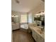 Large bathroom features double sinks and a jacuzzi tub at 9516 Piccadilly Sky Way, Orlando, FL 32827