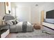 Relaxing bedroom with comfortable bed, decorative rug, and large TV at 9516 Piccadilly Sky Way, Orlando, FL 32827
