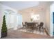 Elegant dining room with stylish light fixture and comfortable seating for six at 9516 Piccadilly Sky Way, Orlando, FL 32827