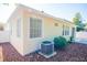 Exterior view of the home with large windows and well maintained landscaping at 9516 Piccadilly Sky Way, Orlando, FL 32827