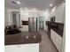 Updated kitchen with granite countertops, stainless steel appliances, white cabinetry and breakfast bar at 9516 Piccadilly Sky Way, Orlando, FL 32827