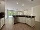 Bright kitchen with stainless steel appliances and a view of the backyard at 9516 Piccadilly Sky Way, Orlando, FL 32827
