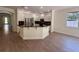Gourmet kitchen features stainless steel appliances, custom cabinets and a breakfast bar at 9516 Piccadilly Sky Way, Orlando, FL 32827