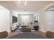 Bright living room with modern decor, large TV, and contemporary furnishings at 9516 Piccadilly Sky Way, Orlando, FL 32827