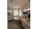 Large bathroom with a soaking tub, dual vanities, and separate shower at 9516 Piccadilly Sky Way, Orlando, FL 32827