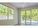 Bright room with outdoor patio access featuring large windows and doors at 9516 Piccadilly Sky Way, Orlando, FL 32827