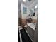 Bathroom featuring an accent-colored toilet, sink, and shower at 1066 Geneva Dr, Oviedo, FL 32765
