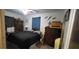 Bedroom featuring a black bedspread and neutral walls at 1066 Geneva Dr, Oviedo, FL 32765