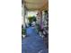 Relaxing front porch features comfortable seating and lush plants at 1066 Geneva Dr, Oviedo, FL 32765