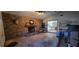 Open-concept living space with brick fireplace and access to dining area at 1066 Geneva Dr, Oviedo, FL 32765