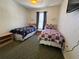 Inviting bedroom showcasing twin beds, neutral decor, and a wall-mounted TV at 1119 Park Ridge Cir, Kissimmee, FL 34746