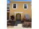 Inviting yellow home featuring white shutters and manicured landscaping creates a welcoming curb appeal at 1119 Park Ridge Cir, Kissimmee, FL 34746