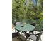 Outdoor patio area with table and chairs, perfect for relaxing and enjoying the scenery at 1119 Park Ridge Cir, Kissimmee, FL 34746