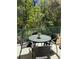 Outdoor patio area with table and chairs, perfect for relaxing and enjoying the scenery at 1119 Park Ridge Cir, Kissimmee, FL 34746