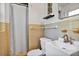 Clean, well-lit bathroom featuring a white vanity, toilet, and shower with decorative tile accents at 112 E Coleman Cir, Sanford, FL 32773