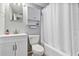 Updated bathroom with a modern vanity, toilet, and shower-tub combo at 112 E Coleman Cir, Sanford, FL 32773