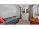 Simple bedroom with window, a dresser, and carpeted flooring at 112 E Coleman Cir, Sanford, FL 32773