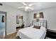 Bedroom with neutral paint, a ceiling fan, and a mirrored closet at 112 E Coleman Cir, Sanford, FL 32773