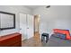 Bedroom with neutral walls, double closets, and a view into an adjacent room at 112 E Coleman Cir, Sanford, FL 32773
