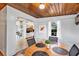 Cozy dining area featuring wood ceilings and a window, adjacent to the kitchen at 112 E Coleman Cir, Sanford, FL 32773