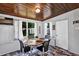 Inviting dining room featuring a wooden ceiling, neutral walls, and a cozy four-seat table setting at 112 E Coleman Cir, Sanford, FL 32773