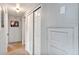 Bright hallway features neutral walls, closet storage, and access to various rooms at 112 E Coleman Cir, Sanford, FL 32773