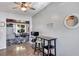 Cozy kitchen area with adjacent dining space, accented by a wooden ceiling fan and neutral decor at 112 E Coleman Cir, Sanford, FL 32773