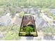 Aerial view of home showcasing the property's landscaping and surrounding neighborhood at 13034 Royal Fern Dr, Orlando, FL 32828