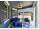 Inviting front porch with comfortable seating, perfect for relaxing and enjoying the outdoors at 13034 Royal Fern Dr, Orlando, FL 32828