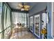 Relaxing patio with tiled flooring, a fan, and furniture for outdoor enjoyment at 13034 Royal Fern Dr, Orlando, FL 32828