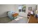 Inviting bedroom with large window offering abundant natural light, complemented by tile flooring at 13133 Sunny Retreat Ln, Winter Garden, FL 34787