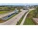 Grand entrance to the community showcasing lush landscaping, cascading water feature, and elegant architecture at 13133 Sunny Retreat Ln, Winter Garden, FL 34787