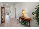 Inviting entryway with decorative table, stylish decor, and elegant tile flooring at 13133 Sunny Retreat Ln, Winter Garden, FL 34787