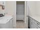 Functional laundry room with washer, dryer, and plenty of counter space at 13133 Sunny Retreat Ln, Winter Garden, FL 34787