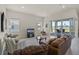 Spacious living room with comfortable seating, and access to outdoor patio at 13133 Sunny Retreat Ln, Winter Garden, FL 34787