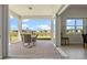 Covered patio with outdoor dining set and pavers, offering scenic backyard views at 13133 Sunny Retreat Ln, Winter Garden, FL 34787