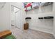 Bright storage space with built-in shelving, a closet, and tile flooring at 13133 Sunny Retreat Ln, Winter Garden, FL 34787