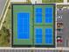 Overhead view of pristine tennis courts, showcasing excellent facilities and recreational opportunities at 13133 Sunny Retreat Ln, Winter Garden, FL 34787