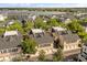 Overhead view of townhomes near a lake, featuring garages and tree-lined streets at 1316 Lake Baldwin Ln, Orlando, FL 32814
