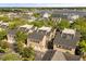 Community aerial shot featuring townhomes with lake views surrounded by mature trees at 1316 Lake Baldwin Ln, Orlando, FL 32814