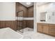 Modern bathroom showcasing wood paneled walls, standing shower and a floating vanity at 1316 Lake Baldwin Ln, Orlando, FL 32814