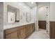 Bathroom featuring double vanity, marble accents, and a private toilet room at 1316 Lake Baldwin Ln, Orlando, FL 32814