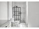 Modern bathroom featuring marble tile, a sleek glass shower enclosure, and contemporary fixtures at 1316 Lake Baldwin Ln, Orlando, FL 32814