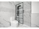 Modern bathroom with white marble-style tile, a black-framed shower, and a contemporary toilet at 1316 Lake Baldwin Ln, Orlando, FL 32814